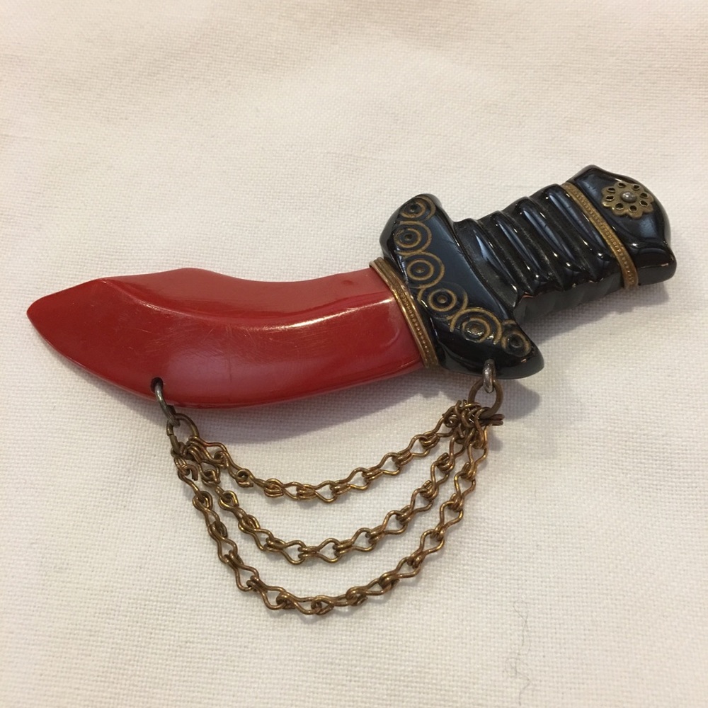 Vintage bakelite sword pin